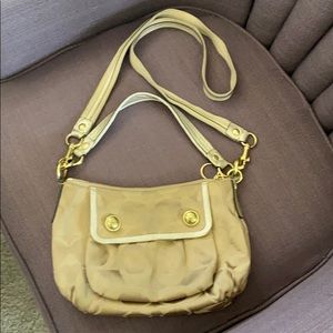 Gold coach bag